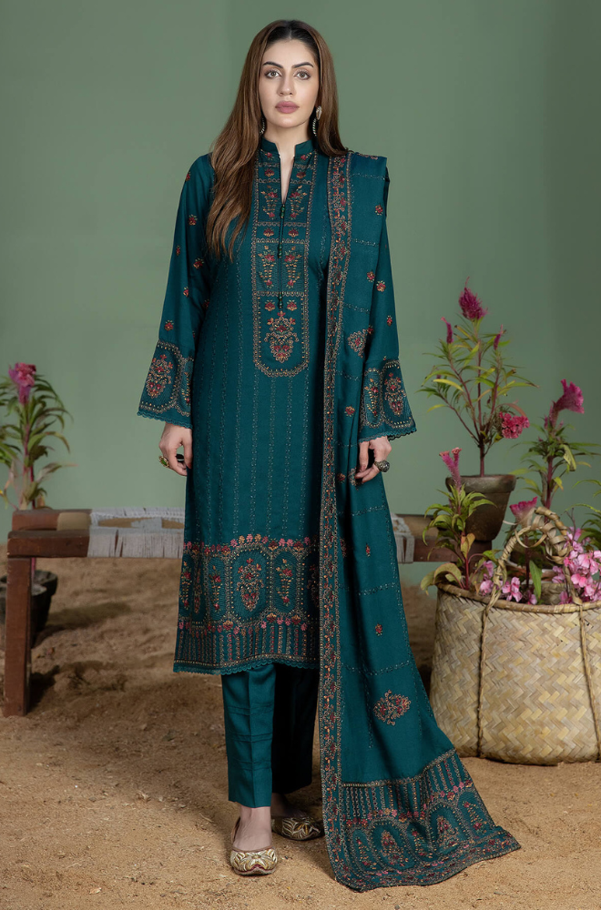 Teal embroidered suit featuring a stylish blue and brown print, showcasing intricate design and vibrant colors.
