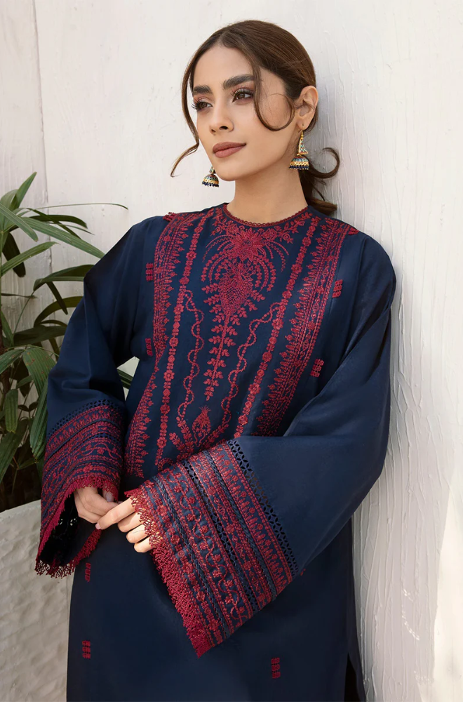 A model showcasing a navy blue embroidered kurta suit, highlighting intricate designs and elegant craftsmanship.