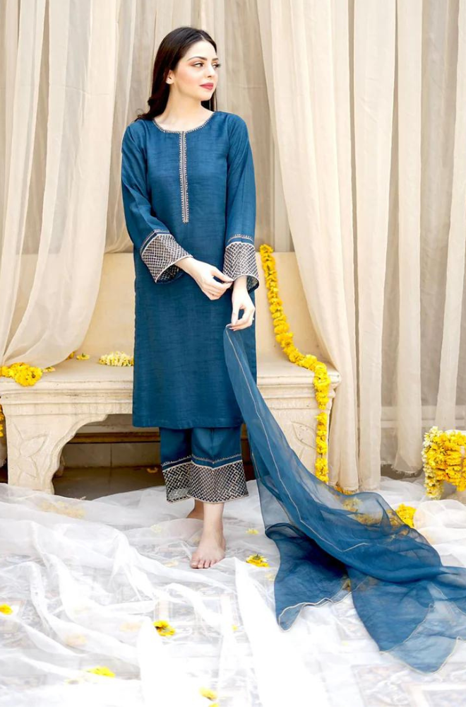 Elegant blue embroidered suit by Sana Khan, featuring detailed embellishments and a sophisticated silhouette.