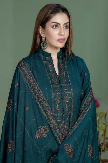 Teal suit with exquisite embroidery, complemented by a distinctive blue and brown print, perfect for formal occasions.
