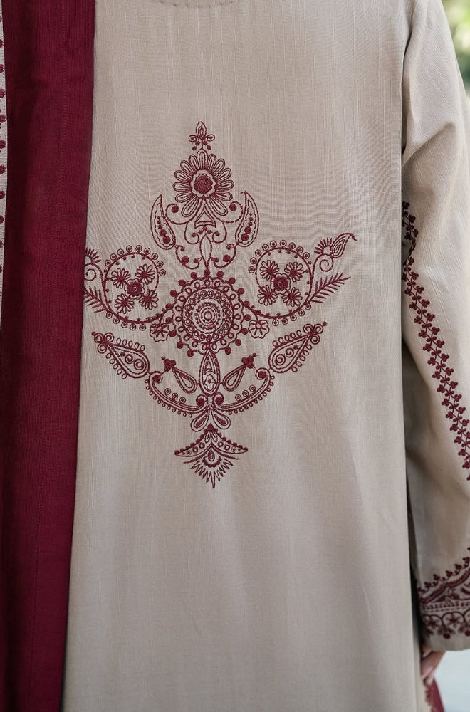  The back view of a woman's dress featuring intricate embroidered designs in vibrant colors.
