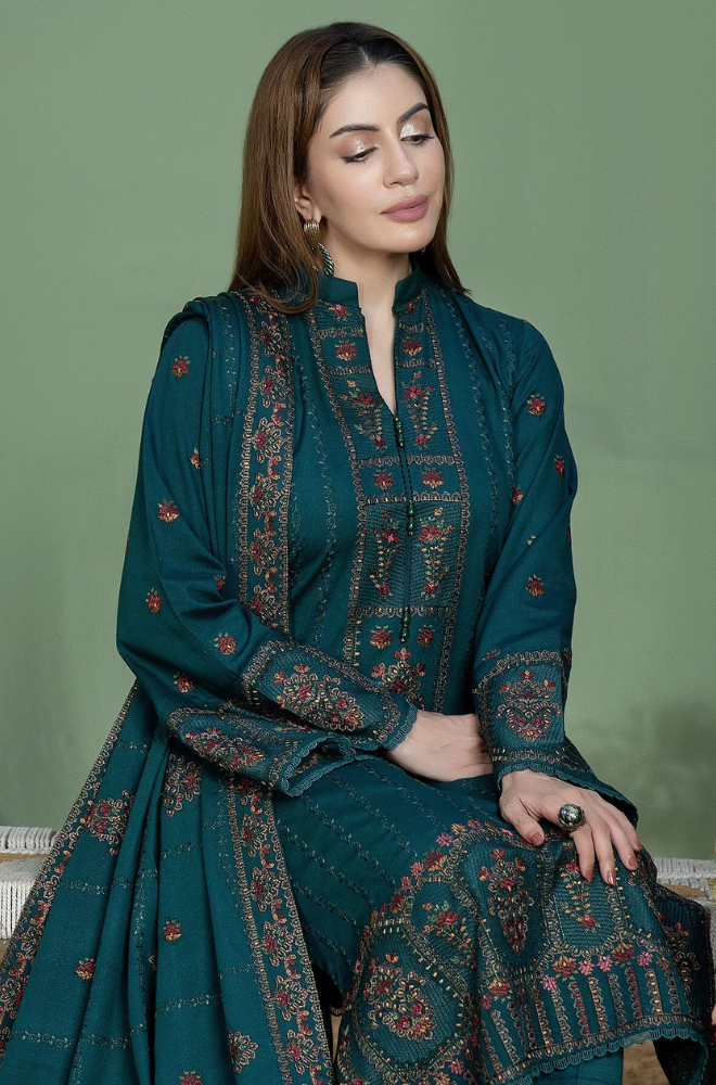 A stunning green Pakistani suit, showcasing intricate design and vibrant color, perfect for any elegant occasion.