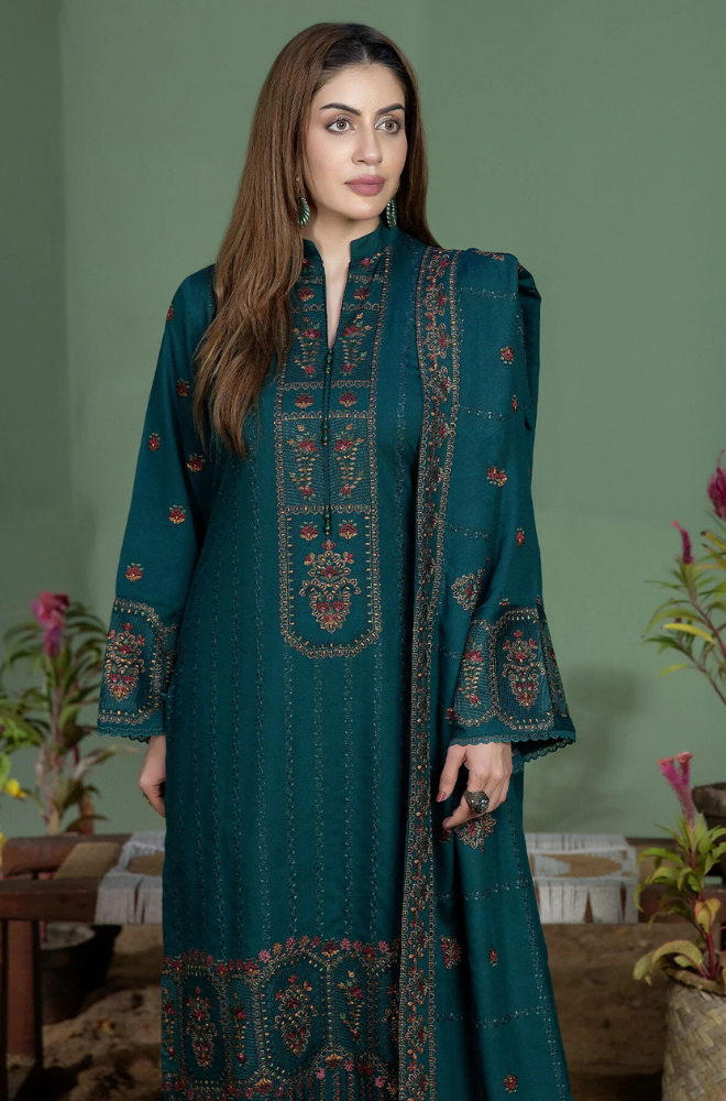  Elegant teal suit with detailed embroidery, adorned with a unique blue and brown print for a sophisticated look.