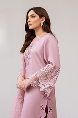 A stylish pink suit embellished with intricate embroidery, demonstrating exquisite craftsmanship and attention to detail.
